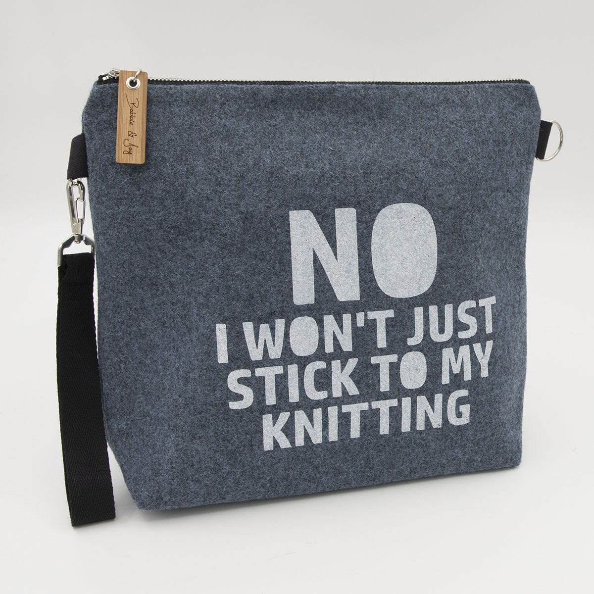 Blue wool felt zipped bag with No I won't stick to my knitting print