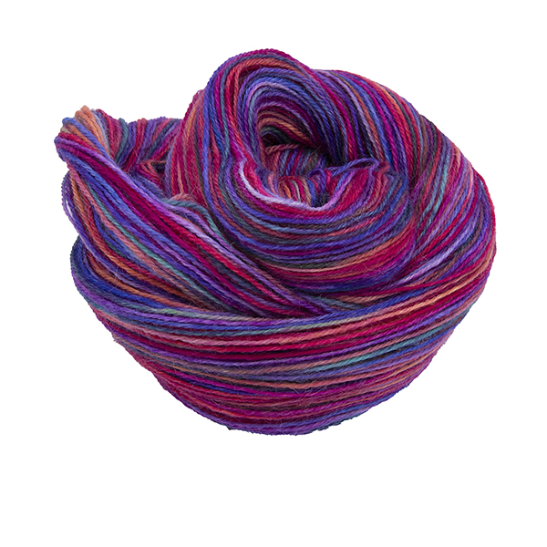 Skein of hand dyed yarn in pink rainbow