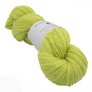 skein of bright lime green colour hand dyed Britsock yarn from The Knitting Goddess with ball band