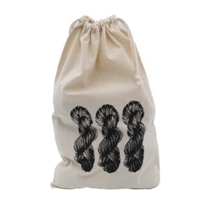 cream cotton drawstring bag with screen print design. Design is of three skeins of yarn and is printed in black. Drawstring on bag is closed