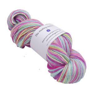 skein of hand dyed britsock yarn in ultimate rainbow with pink, turquoise and yellow