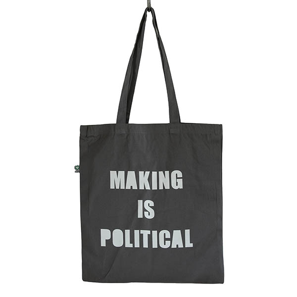 dark grey cotton tatoe bag screen printed with MAKING IS POLITICAL in large white capital letters