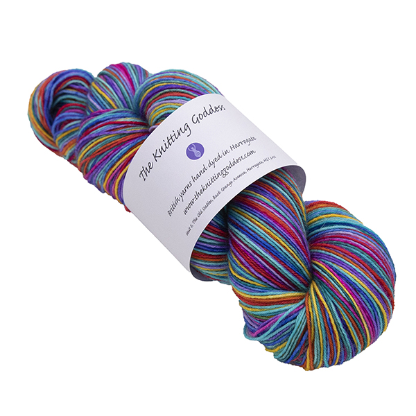 skein of rainbow self striping yarn hand dyed by The Knitting Goddess