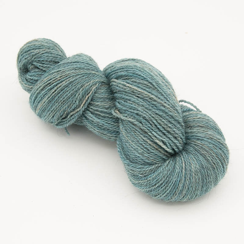 Skein of green yarn for skint skeins, plied