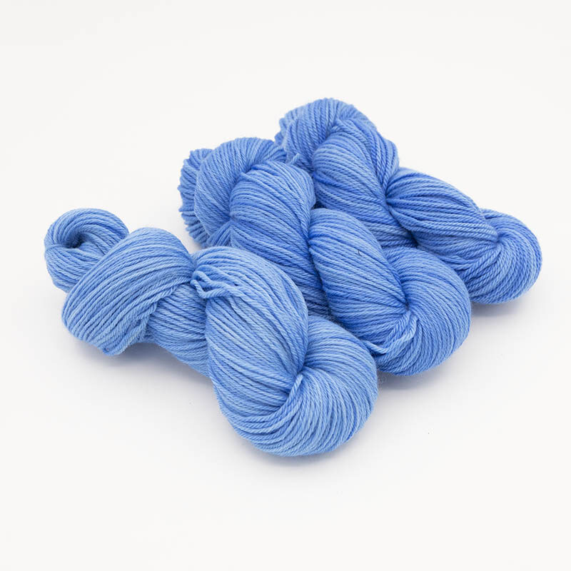 Three skeins of blue yarn for skint skeins, plied
