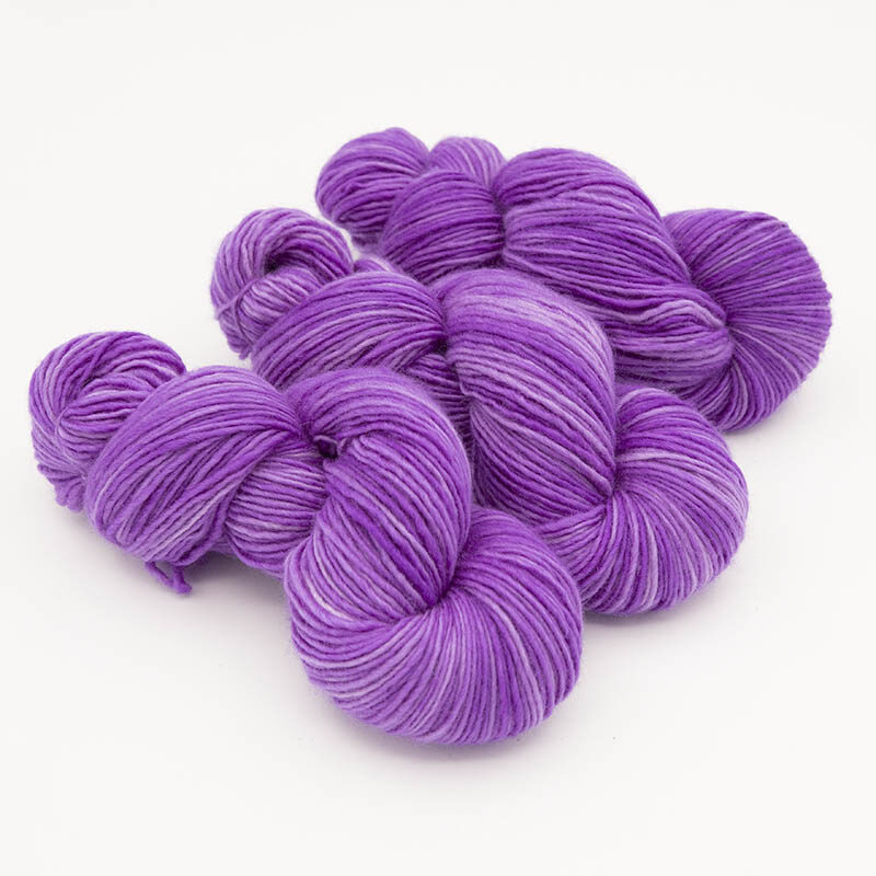 Three skeins of purple yarn for skint skeins, singles