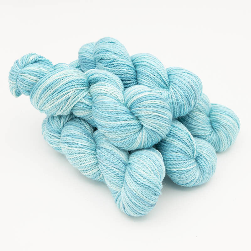 Five skeins of silky turquoise yarn for skint skeins, plied