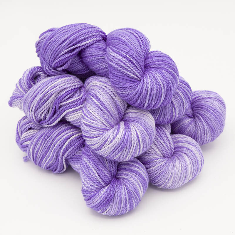 Six skeins of silky lilac yarn for skint skeins, plied