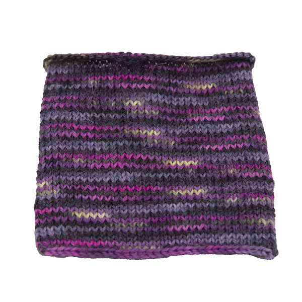 a swatch of Hope : the light within the dark Britsock. dark grey background, pink lines and flashes of yellow