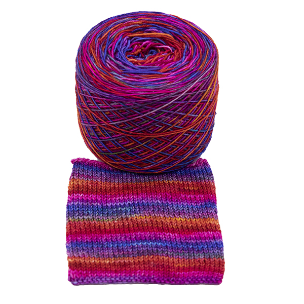 Ball of self striping sock yarnPink Rainbow . Rainbow colours overdyed with bright pink giving sunset colours, shown with knitted sample