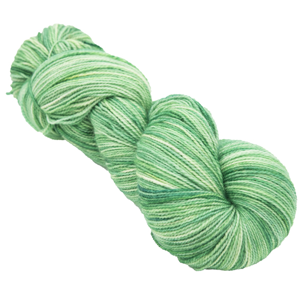 skein of hand dyed pea green sock yarn