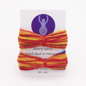 two lengths of multi coloured self striping sock yarn wrapped round a business card.