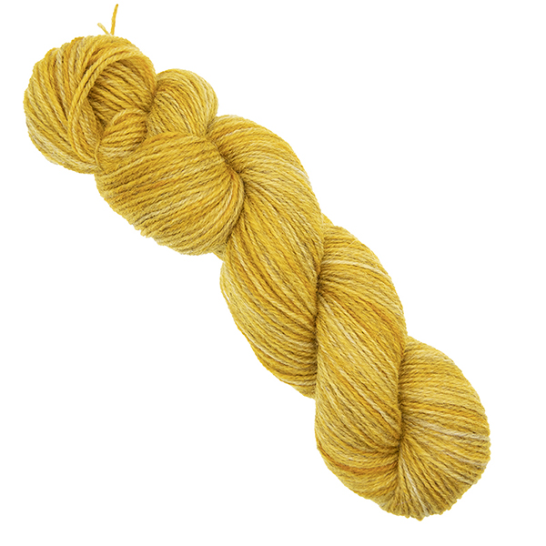 gold skein of hand dyed yarn with The Knitting Goddess ball band