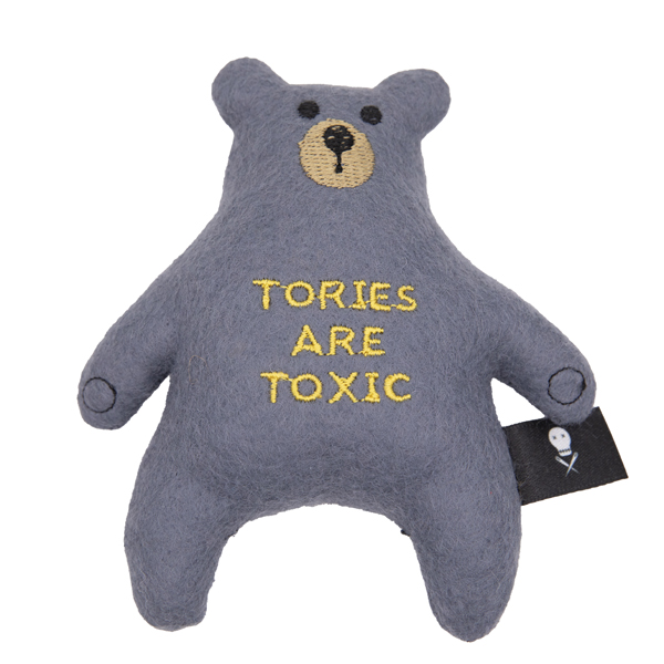 charcoal felt bear embroidered with nose, eyes, paws and the words TORIES ARE TOXIC