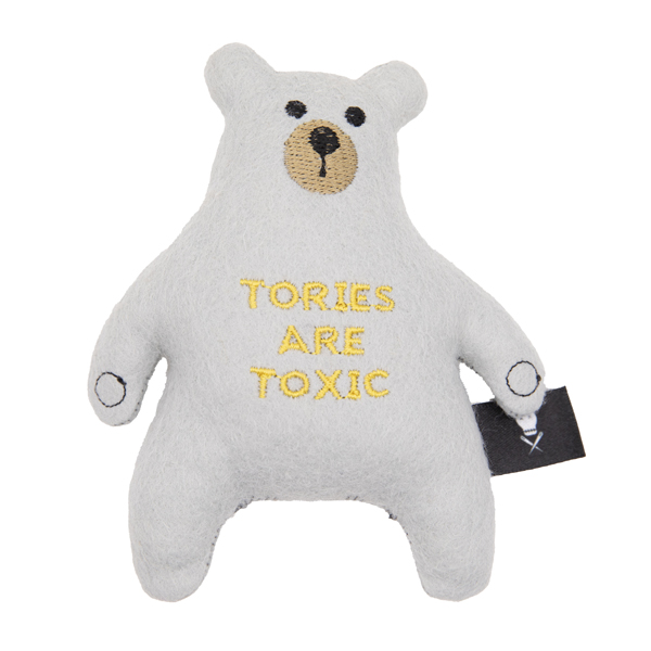 silver felt bear embroidered with nose, eyes, paws and the words TORIES ARE TOXIC