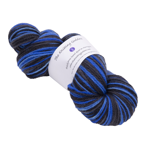 hand dyed DK sock yarn in black and blue with The Knitting Goddess ball band