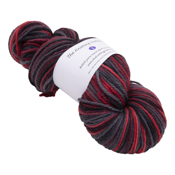 hand dyed DK sock yarn in red and black with The Knitting Goddess ball band