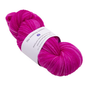hand dyed DK sock yarn in bright pink with The Knitting Goddess ball band