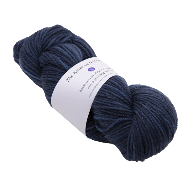 hand dyed DK sock yarn in navy with The Knitting Goddess ball band