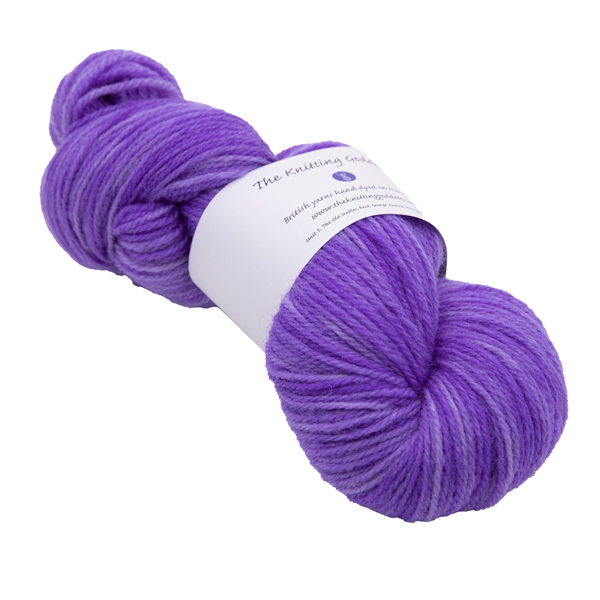 hand dyed DK sock yarn in purple with The Knitting Goddess ball band