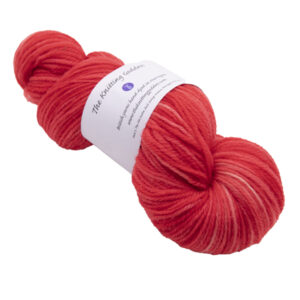 hand dyed DK sock yarn in red with The Knitting Goddess ball band