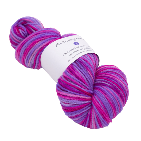 hand dyed DK sock yarn in pink and purple with The Knitting Goddess ball band
