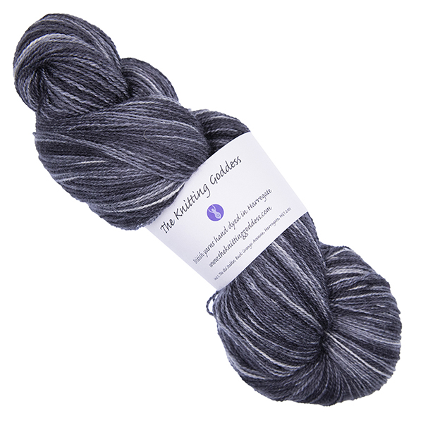 charcoal grey skein of hand dyed wool and silk yarn with The Knitting Goddess ball band