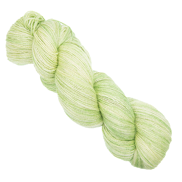 lime green skein of hand dyed wool and silk yarn with The Knitting Goddess ball band