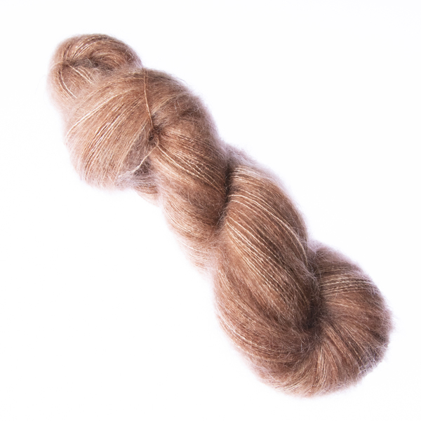 Caramel hand dyed fluffy mohair silk yarn in a skein