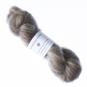 Fawn hand dyed fluffy mohair silk yarn in a skein with The Knitting Goddess ball band