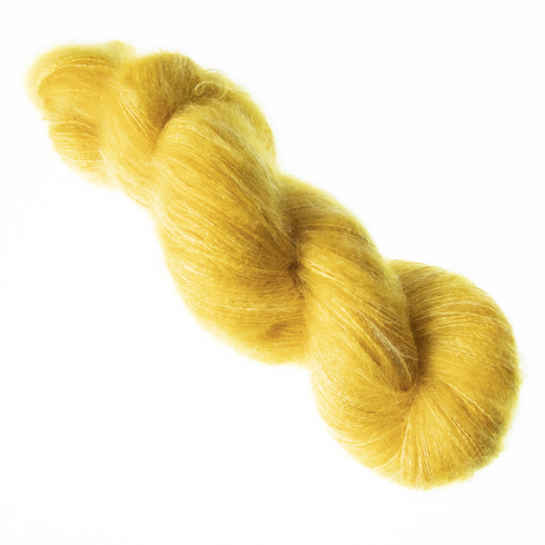Gold hand dyed fluffy mohair silk yarn in a skein