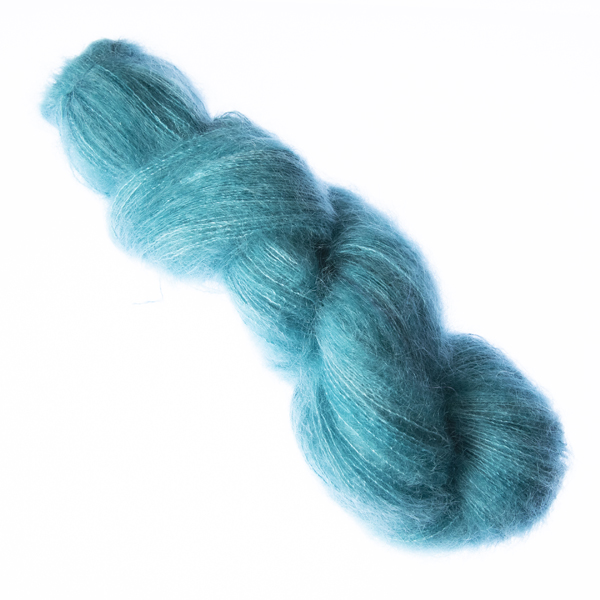Green hand dyed fluffy mohair silk yarn in a skein