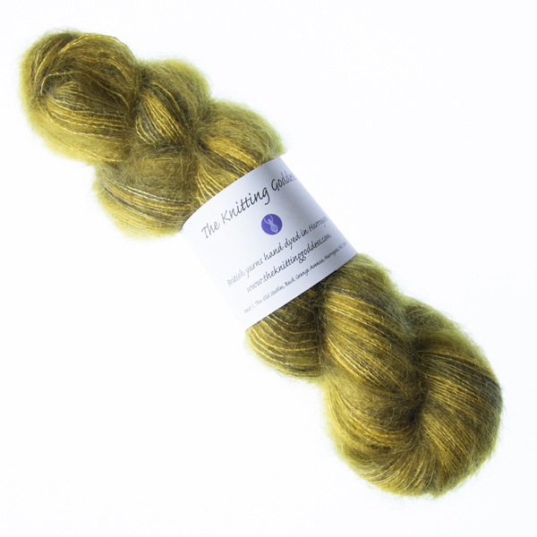 Grellow hand dyed fluffy mohair silk yarn in a skein with The Knitting Goddess ball band
