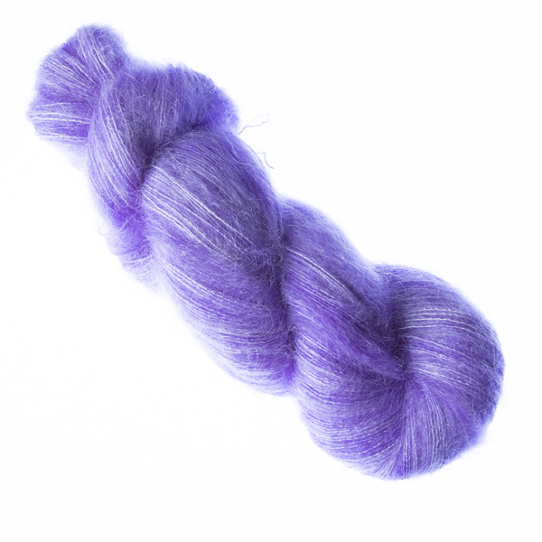 Purple hand dyed fluffy mohair silk yarn in a skein