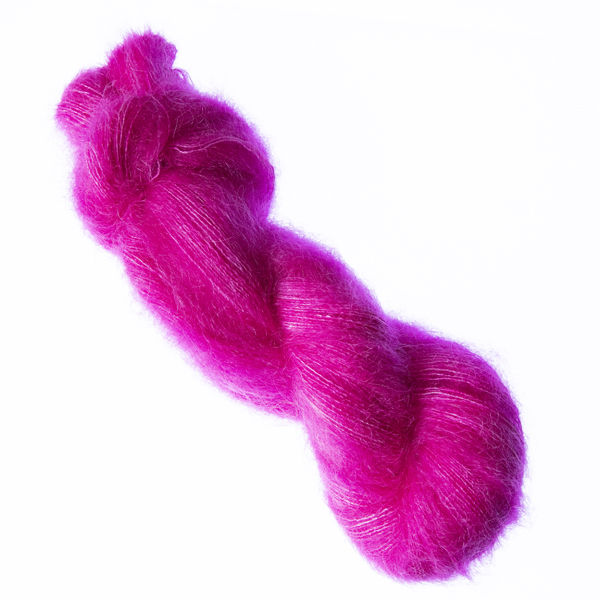 Raspberry hand dyed fluffy mohair silk yarn in a skein