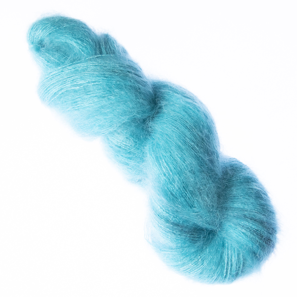Turquoise hand dyed fluffy mohair silk yarn in a skein