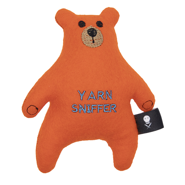 orange felt bear embroidered with the text "YARN SNIFFER"
