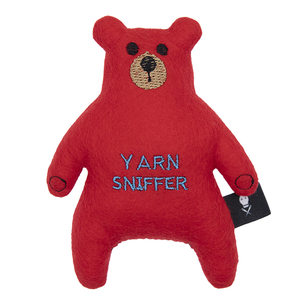 red felt bear embroidered with the text "YARN SNIFFER"