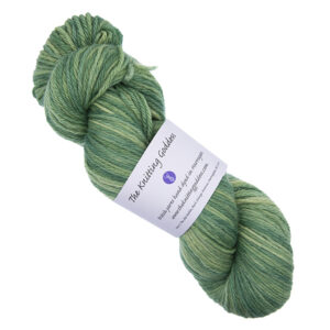 skein of forest green hand dyed DK weight wool yarn with The Knitting Goddess ball band