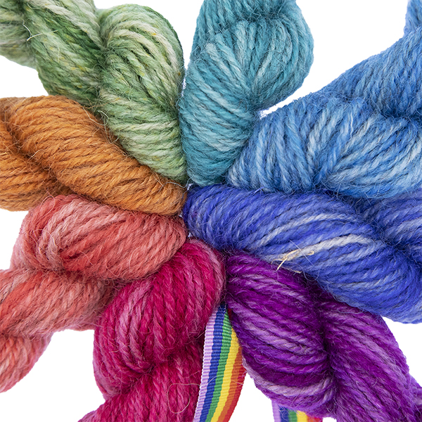 close up of 8 mini skeins in rainbow colours