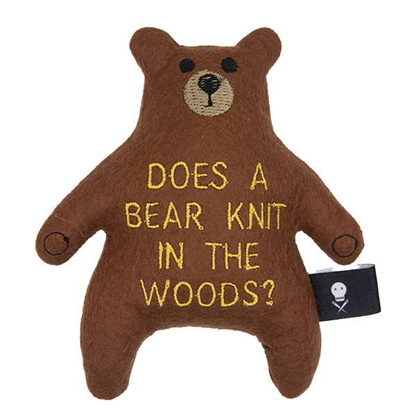 brown felt bear embroidered with "DOES A BEAR KNIT IN THE WOODS?"