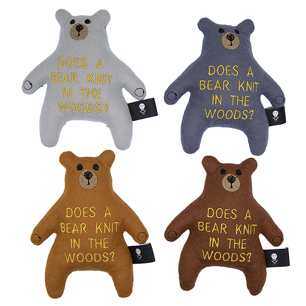 four felt bears in silver, charcoal, caramel and brown embroudered with text "DOES A BEAR KNIT IN THE WOODS?"