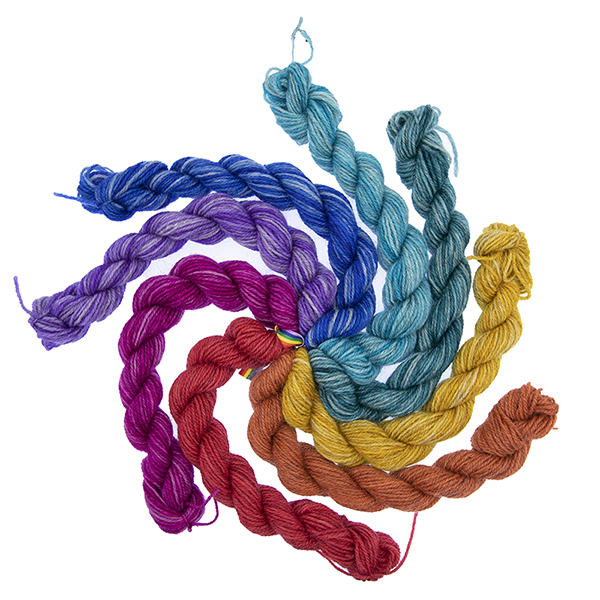 8 mini skeins in rainbow colours arranged in a swirl