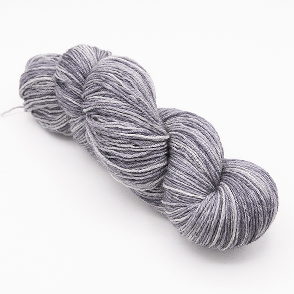 skein of hand dyed light grey yarn