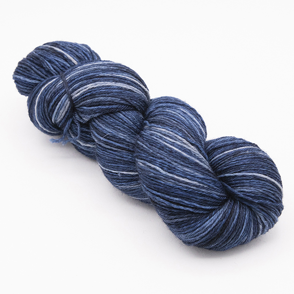 skein of hand dyed blackened blue yarn