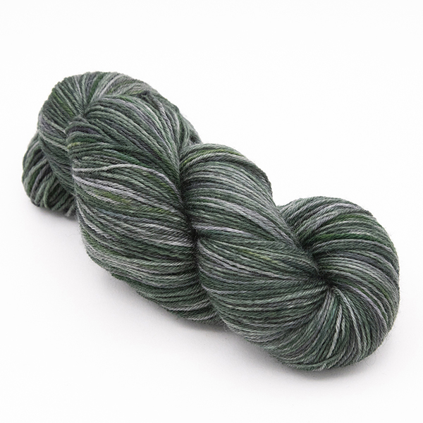 skein of hand dyed blackened forest green yarn