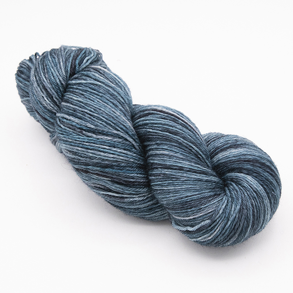 skein of hand dyed blackened turquoise yarn