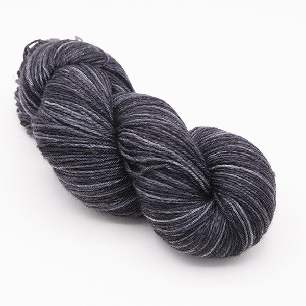 skein of hand dyed coal grey yarn