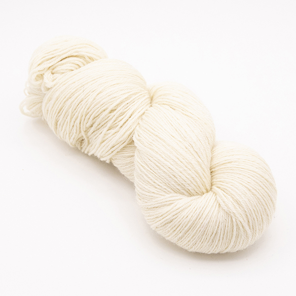 skein of hand dyed cream yarn