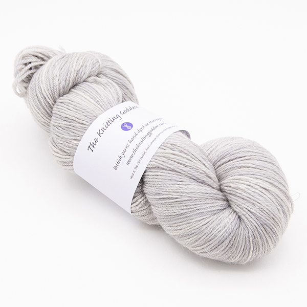 skein of hand dyed pearl yarn with The Knitting Goddess label